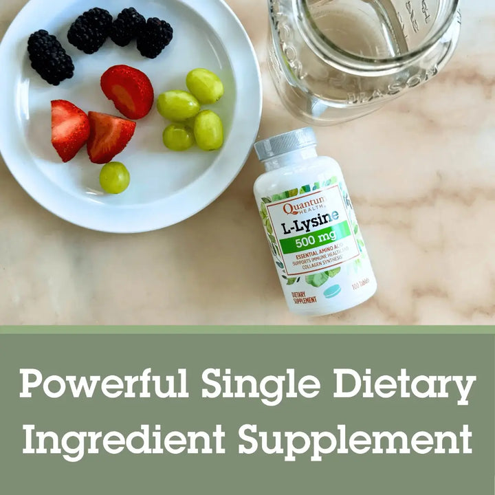 Supplement bottle labeled 'L-Lysine' with a plate of fruits and a glass of water on a marble surface.